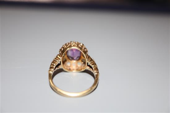 A 9ct, amethyst and split pearl set oval dress ring, size L, gross 3.6 grams.